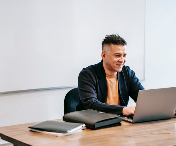 Person working at a modern desk looking focused and relaxed.